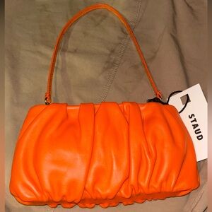 NWT STAUD BEAN LEATHER CLUTCH IN BLOOD ORANGE